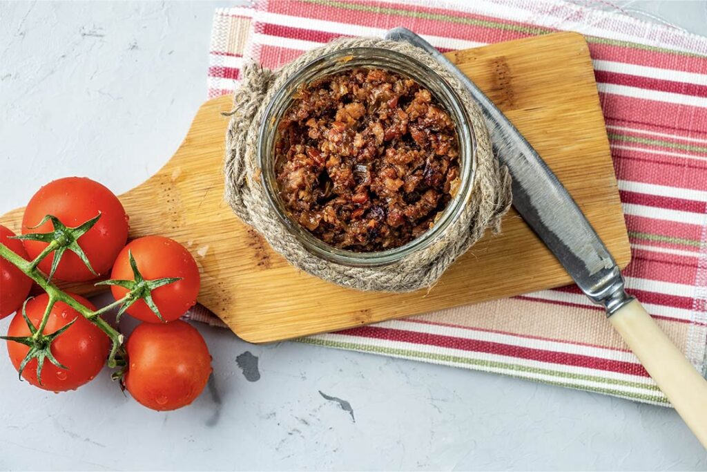 Bird's eye view of bacon jam on chopping board