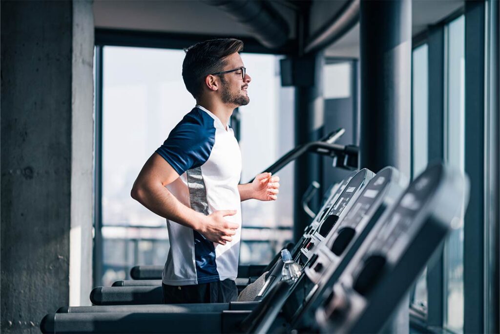 Image of person running on treadmill, used on blog about staying healthy